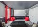 Home theater with projector, screen, and comfy beanbag chairs at 1540 Maidstone Ct, Davenport, FL 33896