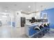 Open kitchen with island seating and stainless steel appliances at 1540 Maidstone Ct, Davenport, FL 33896