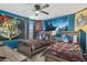 Themed bedroom with twin-size beds and house banners at 1540 Maidstone Ct, Davenport, FL 33896