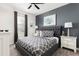 Spacious bedroom with a comfortable king-size bed and plenty of natural light at 1540 Maidstone Ct, Davenport, FL 33896