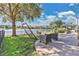 Backyard with a practice net and seating area near the lake at 1562 Amaryllis Cir, Orlando, FL 32825