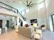 Bright living room with high ceilings, fireplace and access to balcony at 16779 Broadwater Ave, Winter Garden, FL 34787