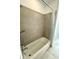 Clean bathroom with a shower/tub combo and tile surround at 16779 Broadwater Ave, Winter Garden, FL 34787