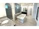 Spa-like bathroom with soaking tub and walk-in shower at 16779 Broadwater Ave, Winter Garden, FL 34787