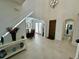 Bright and spacious entryway with views to the dining room at 16779 Broadwater Ave, Winter Garden, FL 34787