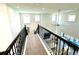 Spacious loft area with a view of the living room below at 16779 Broadwater Ave, Winter Garden, FL 34787
