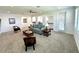 Bright loft area furnished with a sofa and armchairs at 16779 Broadwater Ave, Winter Garden, FL 34787