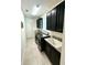 Bright laundry room with modern washer, dryer, and ample cabinetry at 16779 Broadwater Ave, Winter Garden, FL 34787