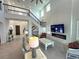 Two-story living room with fireplace and large windows at 16779 Broadwater Ave, Winter Garden, FL 34787