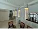 Modern light fixture above a glass dining table at 16779 Broadwater Ave, Winter Garden, FL 34787