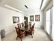 Bright dining room with glass table, wicker chairs, and white walls at 16779 Broadwater Ave, Winter Garden, FL 34787