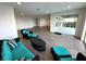 Spacious basement recreation room with large sliding glass doors leading to a patio at 16779 Broadwater Ave, Winter Garden, FL 34787
