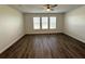 Spacious bedroom with wood-look floors and ceiling fan at 16779 Broadwater Ave, Winter Garden, FL 34787