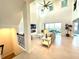 Open living room with high ceilings, fireplace, and balcony access at 16779 Broadwater Ave, Winter Garden, FL 34787