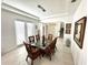Bright dining room with glass table, wicker chairs, and white walls at 16779 Broadwater Ave, Winter Garden, FL 34787