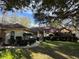 House exterior with walkway, landscaping, and a brown roof at 252 Shady Oaks Cir, Lake Mary, FL 32746