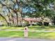 Single-story house with a red tile roof, and mature trees in the front yard at 252 Shady Oaks Cir, Lake Mary, FL 32746