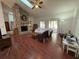 Living room features a brick fireplace, hardwood floors and sliding glass doors at 252 Shady Oaks Cir, Lake Mary, FL 32746
