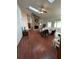Living room with a brick fireplace, hardwood floors, and lots of natural light at 252 Shady Oaks Cir, Lake Mary, FL 32746