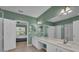 Double vanity bathroom with a large mirror and shower at 2847 Metro Sevilla Dr # 105, Orlando, FL 32835