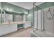 Bathroom with double sinks, shower, and separate tub at 2847 Metro Sevilla Dr # 105, Orlando, FL 32835