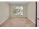 Spacious bedroom with large window and plush carpeting at 2847 Metro Sevilla Dr # 105, Orlando, FL 32835