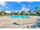 Inviting community pool with lounge chairs and surrounding patio at 2847 Metro Sevilla Dr # 105, Orlando, FL 32835