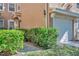 Townhome entrance with walkway and lush green shrubbery at 2847 Metro Sevilla Dr # 105, Orlando, FL 32835
