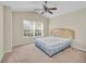 Main bedroom with ceiling fan and window views at 2847 Metro Sevilla Dr # 105, Orlando, FL 32835