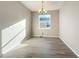 Simple dining room with gray tile floor and a window at 2910 Sweetspire Cir, Oviedo, FL 32766