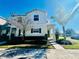 Two-story house with light-colored siding, landscaping, and walkway at 305 Primrose Dr, Davenport, FL 33837