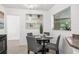 Cozy breakfast nook with a round glass table and gray chairs at 816 Pershing Ave, Orlando, FL 32806