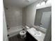 Modern bathroom with tiled shower and vanity at 9650 Nw Gainesville Rd, Ocala, FL 34475