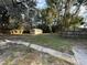 Large backyard with a shed and wooden fence at 1009 Herndon St, Leesburg, FL 34748