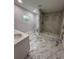 Updated bathroom with a large walk-in shower at 1009 Herndon St, Leesburg, FL 34748