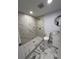 Clean bathroom, marble shower and vanity at 1009 Herndon St, Leesburg, FL 34748