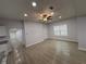 Spacious living room with hardwood floors, recessed lighting and ceiling fan at 1009 Herndon St, Leesburg, FL 34748