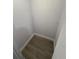Small storage room with wood-look flooring at 1009 Herndon St, Leesburg, FL 34748