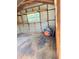 Interior of a storage shed with wooden shelves at 1009 Herndon St, Leesburg, FL 34748