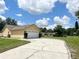 Single car garage with a long driveway at 117 Clowson Ct, Ocoee, FL 34761