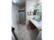 Clean bathroom with shower/tub combo and updated vanity at 117 Clowson Ct, Ocoee, FL 34761