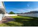 Spacious backyard with grassy area and patio perfect for entertaining at 1349 Castleport Rd, Winter Garden, FL 34787