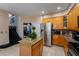 Modern kitchen features stainless steel appliances and granite island at 1349 Castleport Rd, Winter Garden, FL 34787
