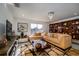 Relaxing living room with sectional sofa, built in shelving, and large windows at 1349 Castleport Rd, Winter Garden, FL 34787