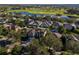 Aerial view showcasing a house and its surroundings, including a golf course at 1349 Castleport Rd, Winter Garden, FL 34787