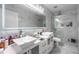 Elegant bathroom with double sinks, marble finishes, and a glass shower at 1349 Castleport Rd, Winter Garden, FL 34787