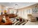 Relaxing living room with sectional sofa, large windows, and area rug at 1349 Castleport Rd, Winter Garden, FL 34787