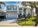 Two-story house with gray siding, gray shutters, and a two-car garage at 1349 Castleport Rd, Winter Garden, FL 34787