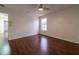 Spacious bedroom with a window, wood-look floors, and a ceiling fan at 14443 Golden Rain Tree Blvd, Orlando, FL 32828