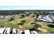Aerial view of community with golf course and mobile homes at 2025 St George Dr, Davenport, FL 33837